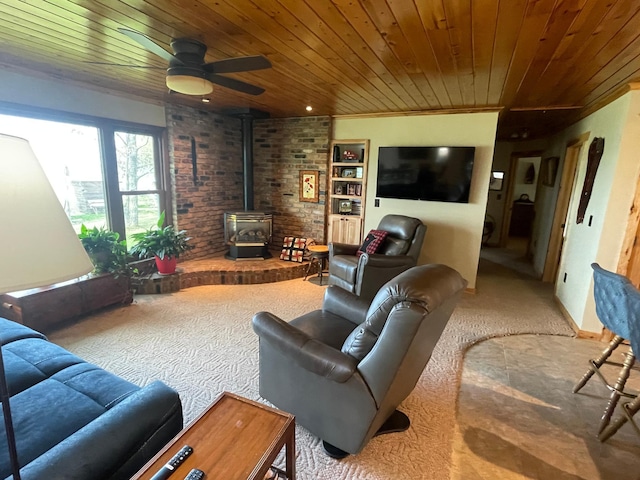 18063 Bernard Trl, Brainerd, MN 56401 - carpeted living room featuring wooden ceiling, a wood stove, a ceiling fan, and brick wall