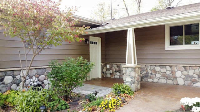 18063 Bernard Trl, Brainerd, MN 56401 - property entrance featuring a porch and stone siding