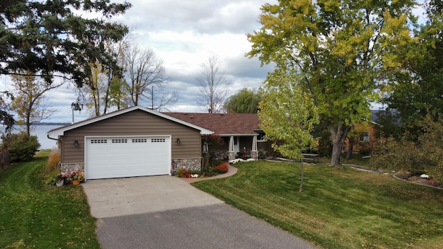 18063 Bernard Trl, Brainerd, MN 56401 - ranch-style house with stone siding, a garage, a front lawn, and driveway