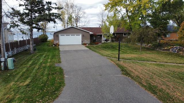 18063 Bernard Trl, Brainerd, MN 56401 - ranch-style house with driveway, an attached garage, and stone siding