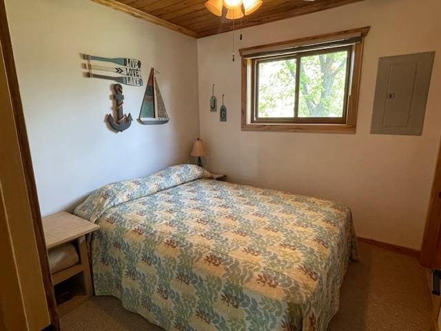 18063 Bernard Trl, Brainerd, MN 56401 - carpeted bedroom featuring electric panel, wood ceiling, and baseboards