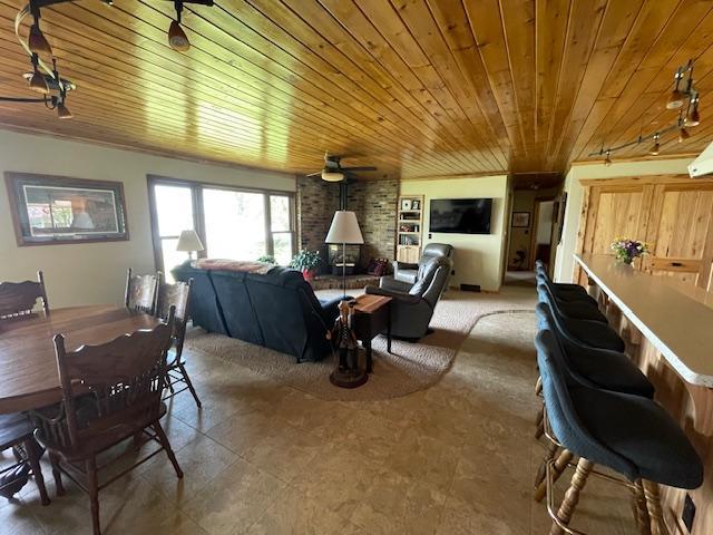 18063 Bernard Trl, Brainerd, MN 56401 - dining space featuring wood ceiling and a ceiling fan
