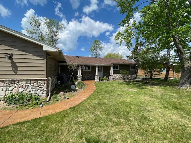 18063 Bernard Trl, Brainerd, MN 56401 - back of property with stone siding and a yard