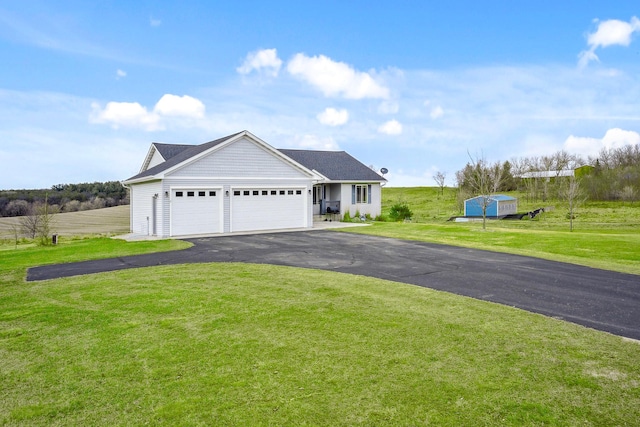 572 172nd St, Pleasant Valley Twp, WI 54015 - view of front of property featuring an attached garage, a front lawn, and asphalt driveway