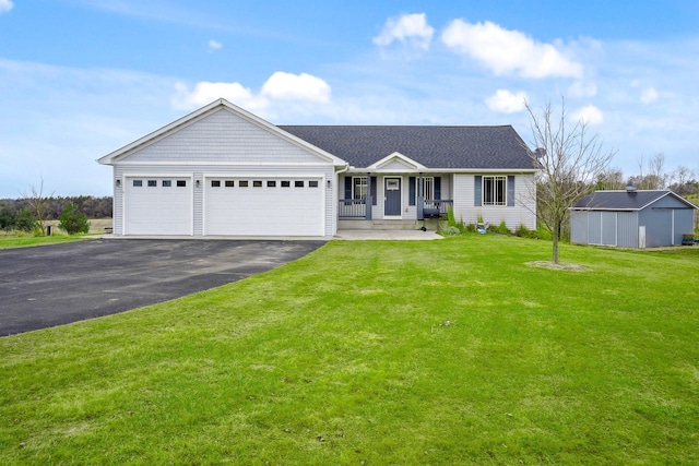 572 172nd St, Pleasant Valley Twp, WI 54015 - single story home with asphalt driveway, a garage, a front yard, and a porch