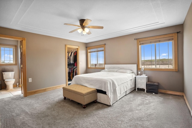 572 172nd St, Pleasant Valley Twp, WI 54015 - carpeted bedroom featuring a walk in closet, a closet, ensuite bathroom, and a ceiling fan