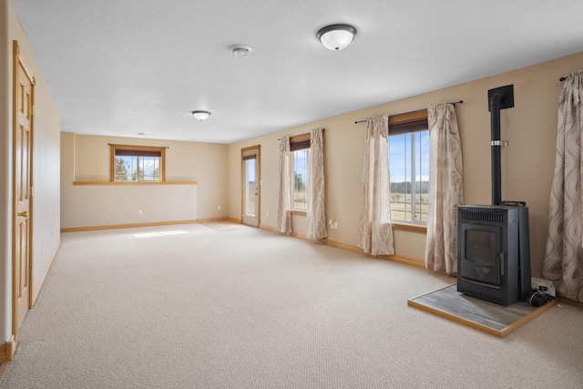 572 172nd St, Pleasant Valley Twp, WI 54015 - unfurnished living room with a wood stove and carpet