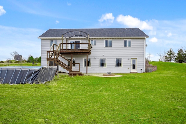 572 172nd St, Pleasant Valley Twp, WI 54015 - back of house with a wooden deck, stairway, a lawn, a patio area, and a covered pool