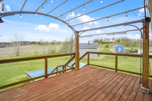 572 172nd St, Pleasant Valley Twp, WI 54015 - deck with a lawn, a view of rural / pastoral area, and an outbuilding