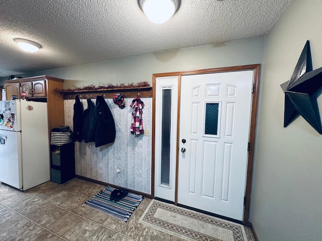 entryway featuring a textured ceiling