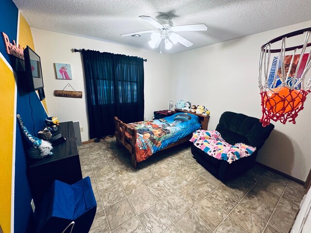 bedroom featuring a textured ceiling and ceiling fan
