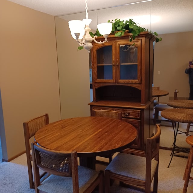 6237 Magda Dr Unit A, Maple Grove, MN 55369 - dining area featuring light colored carpet and a chandelier