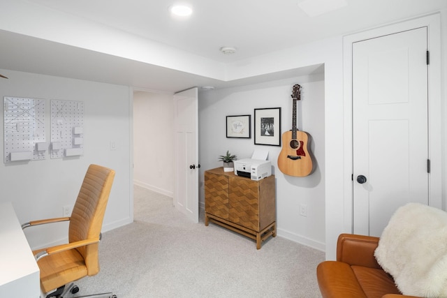 carpeted home office with baseboards