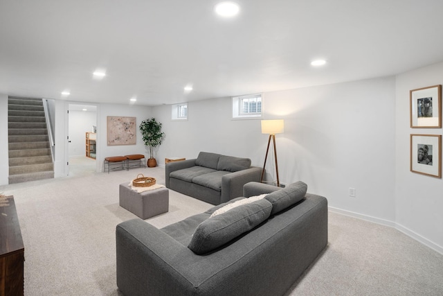 living room with recessed lighting, carpet floors, and stairs