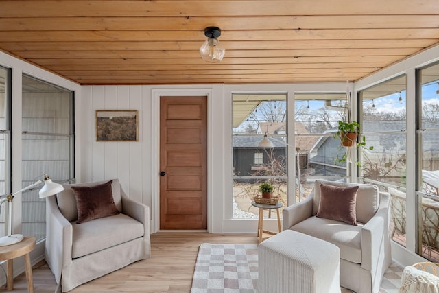 sunroom featuring a wealth of natural light and wooden ceiling