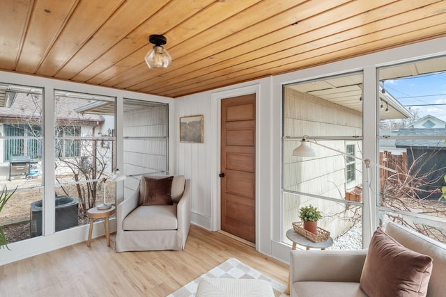 sunroom / solarium featuring wooden ceiling