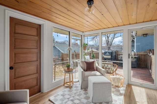 sunroom / solarium featuring wooden ceiling