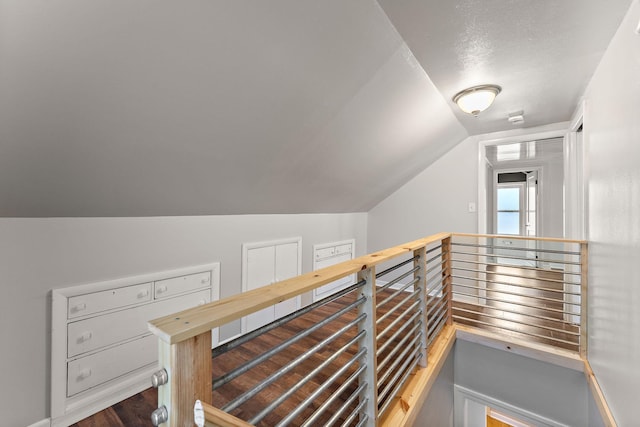 910 Nevada Ave W, Saint Paul, MN 55117 - staircase featuring lofted ceiling and wood finished floors