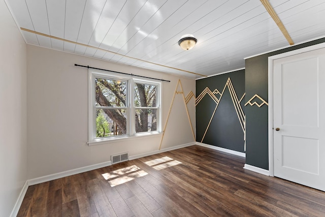 910 Nevada Ave W, Saint Paul, MN 55117 - empty room with dark wood finished floors, baseboards, and wooden ceiling