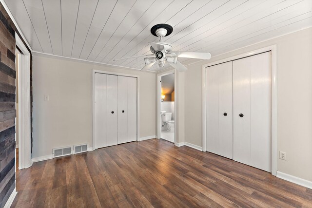 910 Nevada Ave W, Saint Paul, MN 55117 - unfurnished bedroom featuring two closets, wood finished floors, wooden ceiling, a ceiling fan, and baseboards
