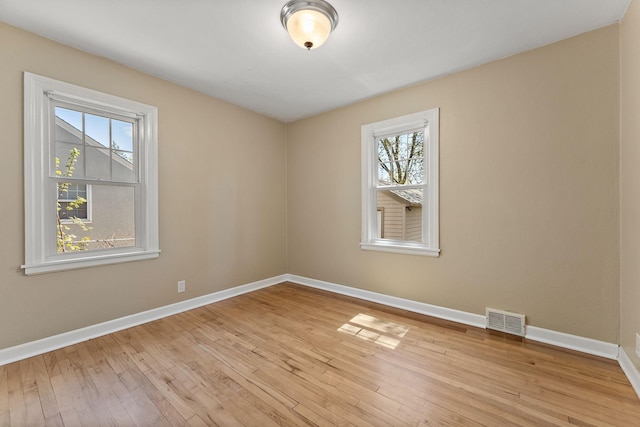 910 Nevada Ave W, Saint Paul, MN 55117 - unfurnished room with baseboards and light wood-type flooring