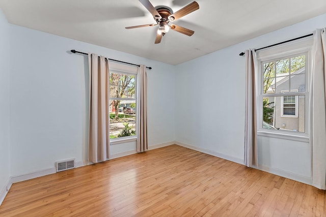 910 Nevada Ave W, Saint Paul, MN 55117 - spare room featuring light wood-type flooring, ceiling fan, and baseboards