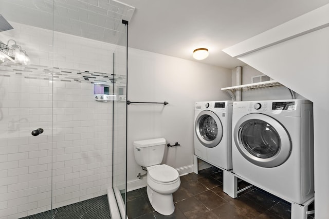 910 Nevada Ave W, Saint Paul, MN 55117 - full bathroom featuring separate washer and dryer, toilet, a shower stall, tile patterned floors, and baseboards