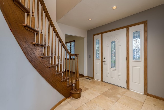 19 Robin Ct, North Mankato, MN 56003 - entryway featuring baseboards, light tile patterned flooring, recessed lighting, and stairs