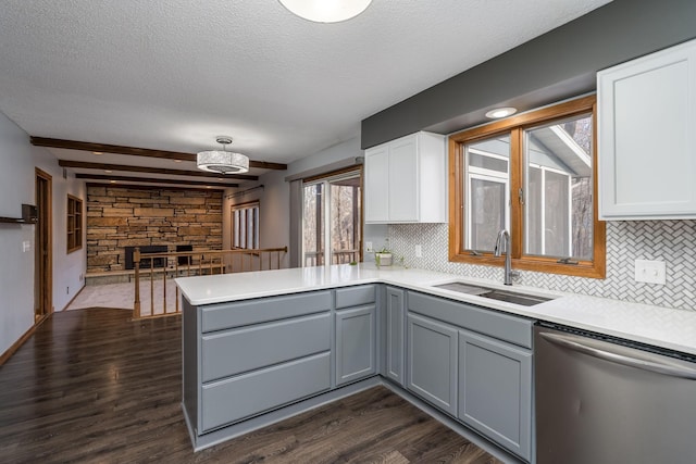 19 Robin Ct, North Mankato, MN 56003 - kitchen with dishwasher, a sink, a peninsula, gray cabinetry, and backsplash