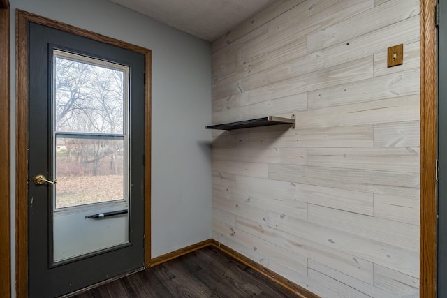 19 Robin Ct, North Mankato, MN 56003 - doorway with dark wood-type flooring and baseboards