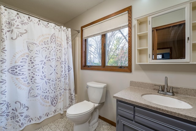 19 Robin Ct, North Mankato, MN 56003 - full bathroom featuring toilet, vanity, a shower with curtain, and baseboards
