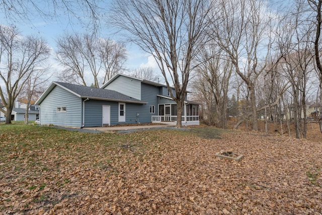 19 Robin Ct, North Mankato, MN 56003 - back of property with a sunroom and a shingled roof