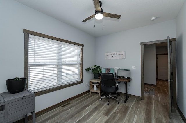 office area with ceiling fan, wood finished floors, and baseboards
