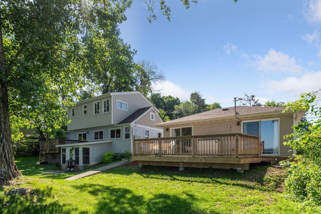 5446 Bartlett Blvd, Mound, MN 55364 - rear view of property featuring a deck and a lawn