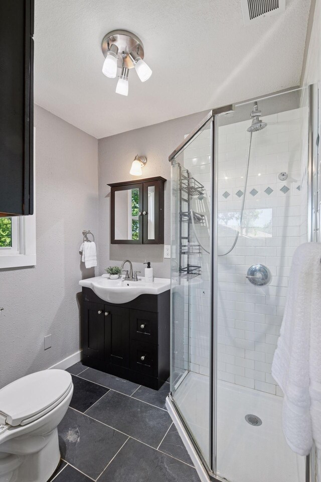 5446 Bartlett Blvd, Mound, MN 55364 - bathroom featuring vanity, a shower stall, and tile patterned floors