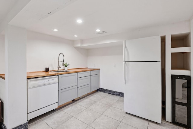 5446 Bartlett Blvd, Mound, MN 55364 - kitchen with white appliances, butcher block counters, beverage cooler, gray cabinets, and recessed lighting