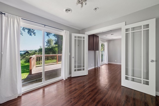 5446 Bartlett Blvd, Mound, MN 55364 - unfurnished room with dark wood finished floors, french doors, and fire sprinkler in ceiling