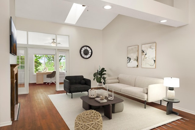 living room featuring baseboards, dark wood-style flooring, ceiling fan, recessed lighting, and a skylight