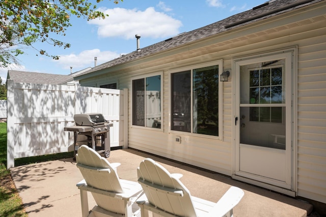 view of patio / terrace featuring area for grilling and fence