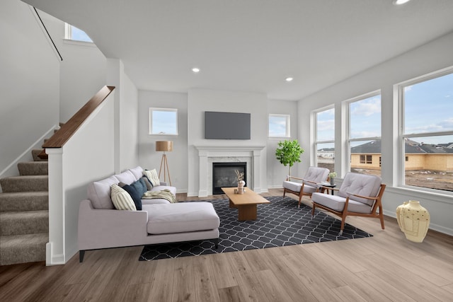 1520 Philipp Way, Shakopee, MN 55379 - living room with wood finished floors, plenty of natural light, recessed lighting, stairs, and a high end fireplace