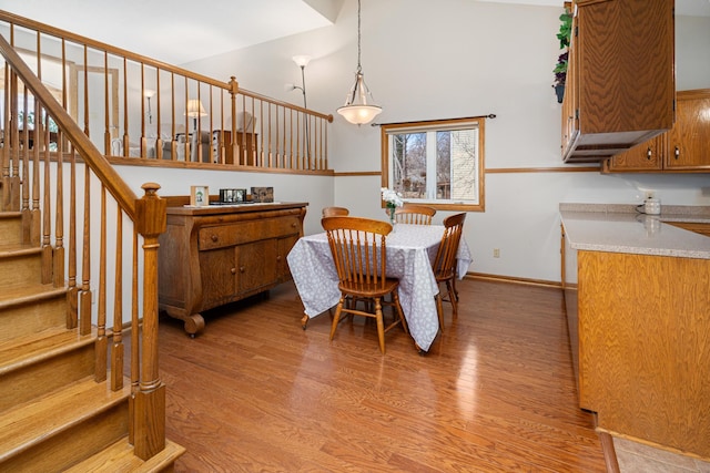 1944 Linda Ln, Saint Cloud, MN 56301 - dining room featuring light wood finished floors, stairway, and baseboards