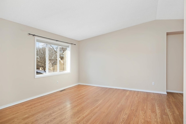 unfurnished room with visible vents, baseboards, and light wood-style floors