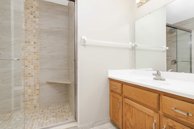full bathroom featuring vanity and a shower stall