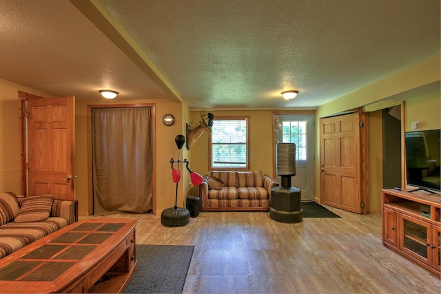 2071 Erickson Ln, Mora, MN 55051 - living area featuring a textured ceiling and light wood-style floors