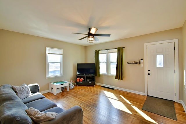 2604 Clearwater Rd, Saint Cloud, MN 56301 - living room with light wood-style flooring, ceiling fan, and baseboards