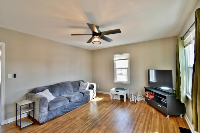 2604 Clearwater Rd, Saint Cloud, MN 56301 - living room with a ceiling fan, light wood-style flooring, and baseboards