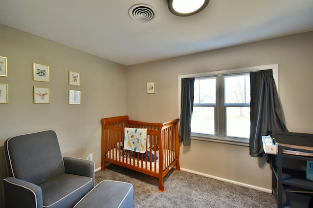 2604 Clearwater Rd, Saint Cloud, MN 56301 - carpeted bedroom with baseboards and a crib