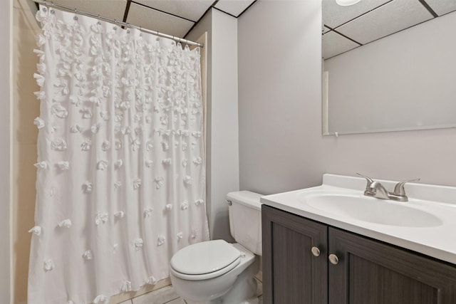 bathroom with vanity, a paneled ceiling, toilet, and a shower with curtain