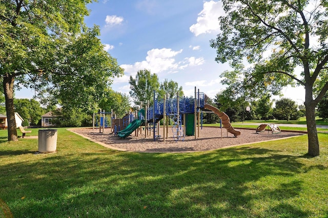 community jungle gym featuring a lawn