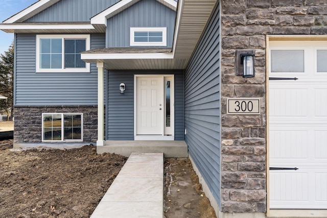 224 9th Ave Ct NW, Lonsdale, MN 55046 - property entrance with stone siding and a garage